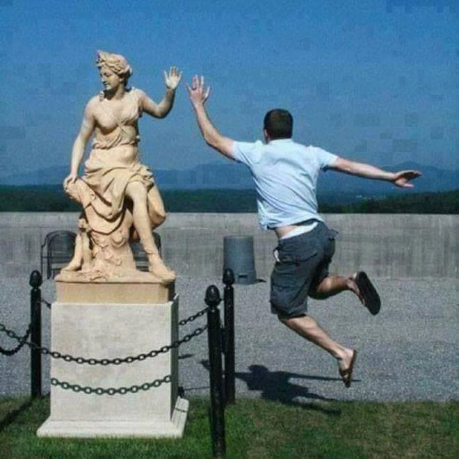 Hilarious Pics Of People Posing With Statues Boldsky